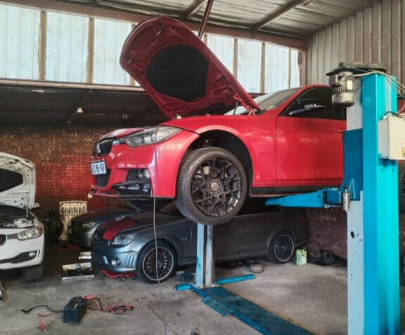 Goshen Auto Team Servicing a Car
